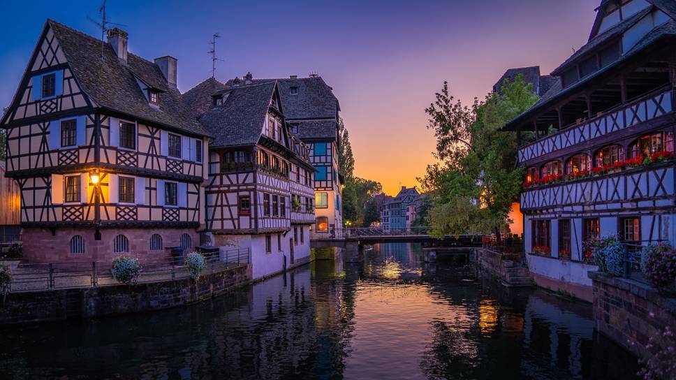 Buildings and bridge near river in Strasbourg